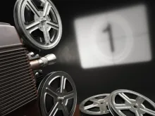 Projector pointing at a screen with the number 1 being shown