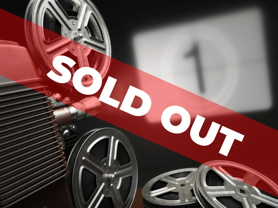 The words "SOLD OUT" displayed over a projector pointed at a screen